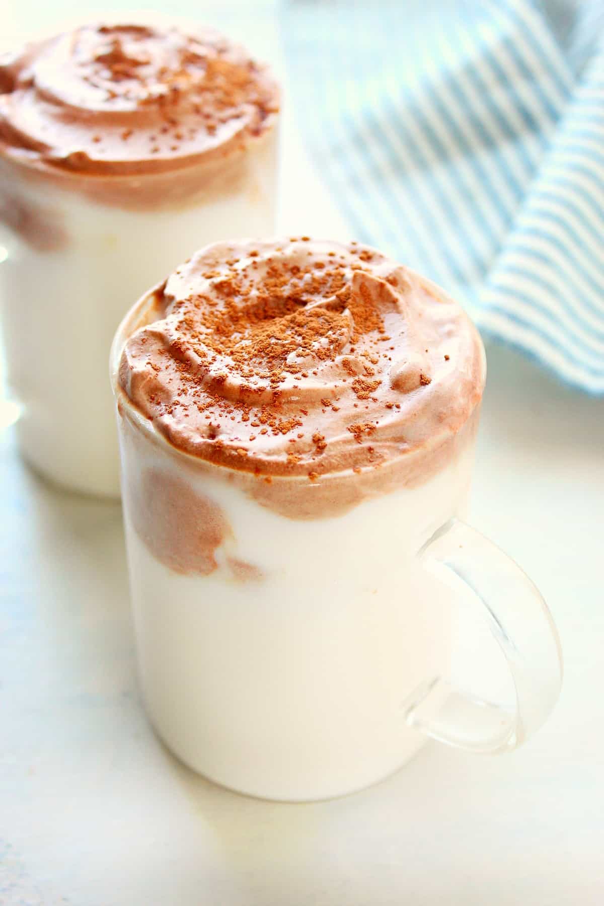 Whipped hot chocolate in two glasses.