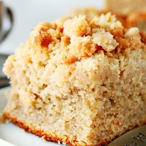 Piece of crumb cake on a plate.