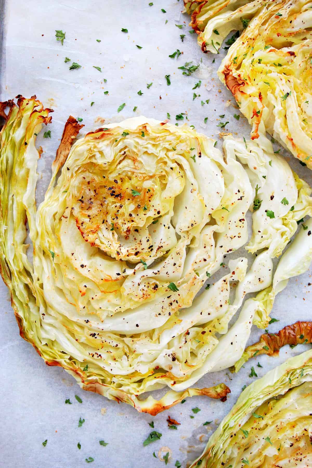 Roasted cabbage slice on parchment.