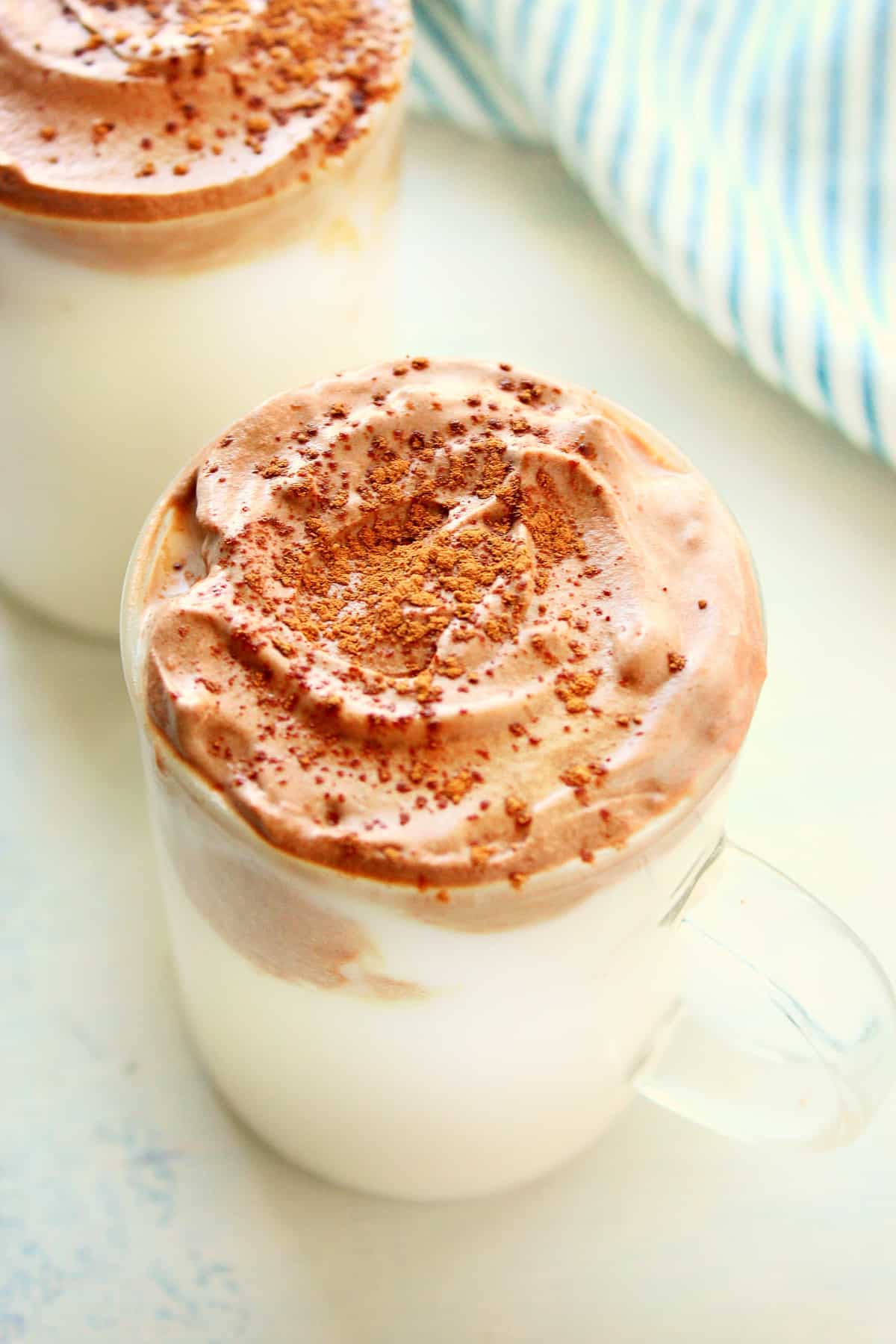 Whipped hot chocolate in a glass.