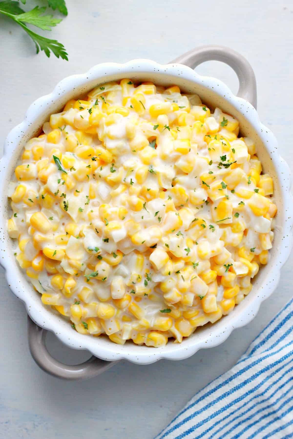 Creamed corn in a round dish.