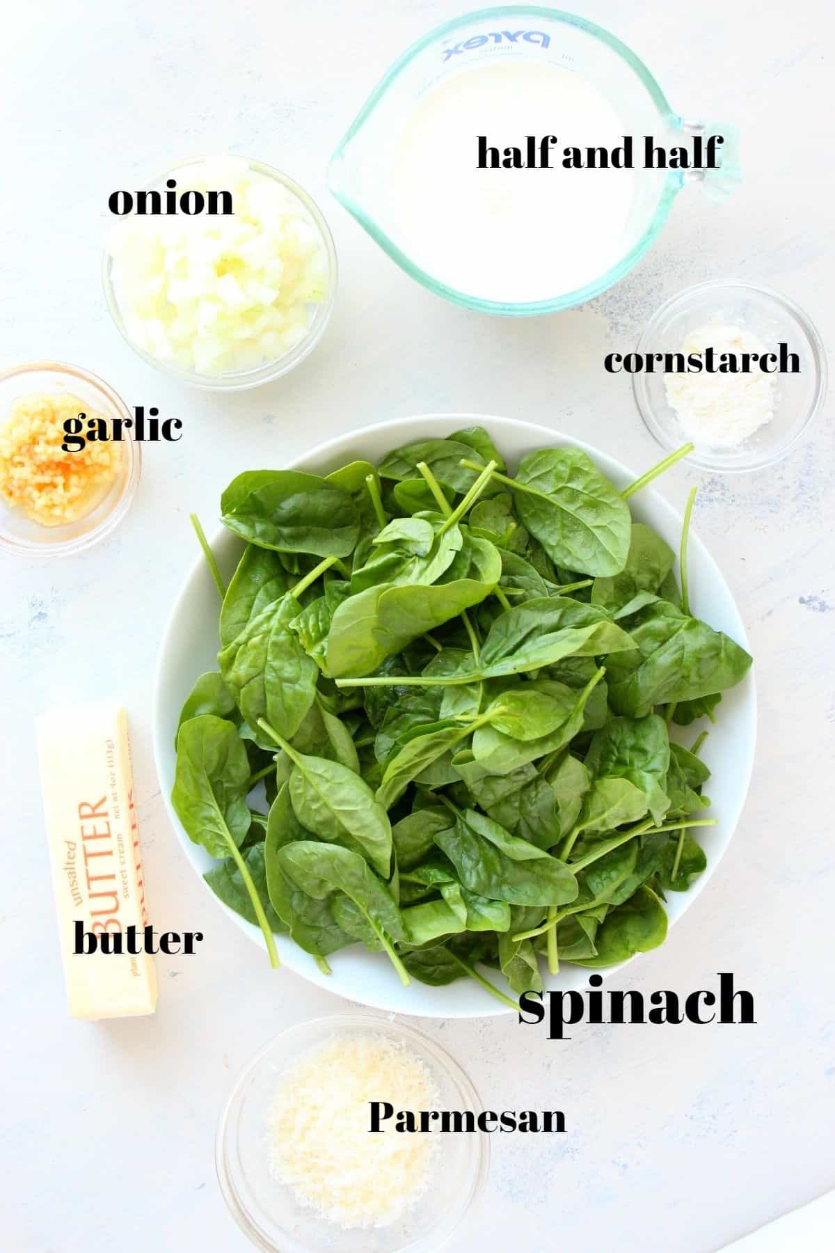 Ingredients for spinach side dish on a board.