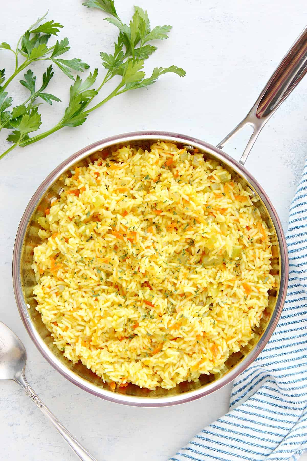 Rice dish in a stainless steel pan.