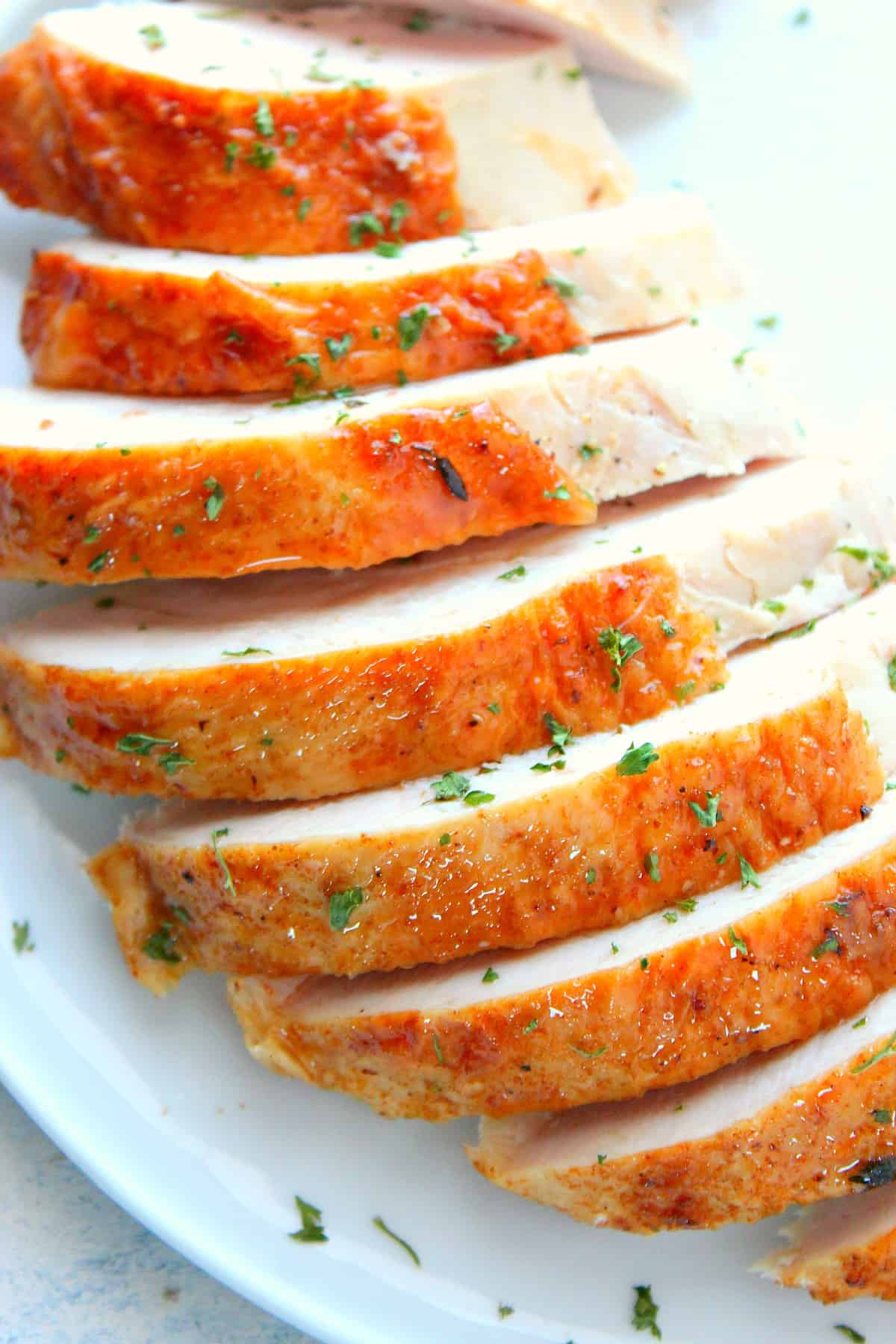 Sliced turkey breast on a plate.