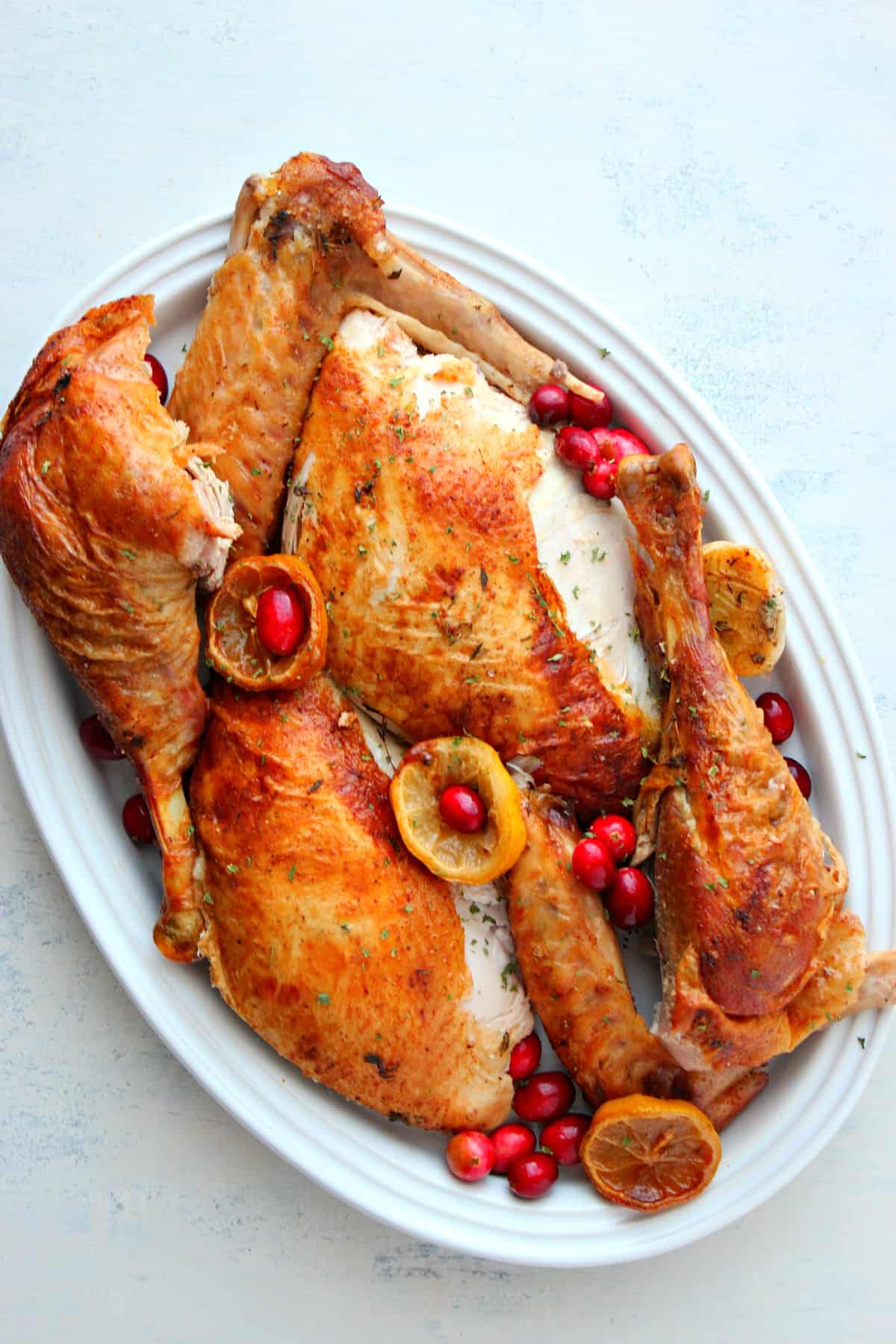 Parts of roasted turkey on a platter.