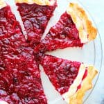 Cranberry pie in a glass pie plate.