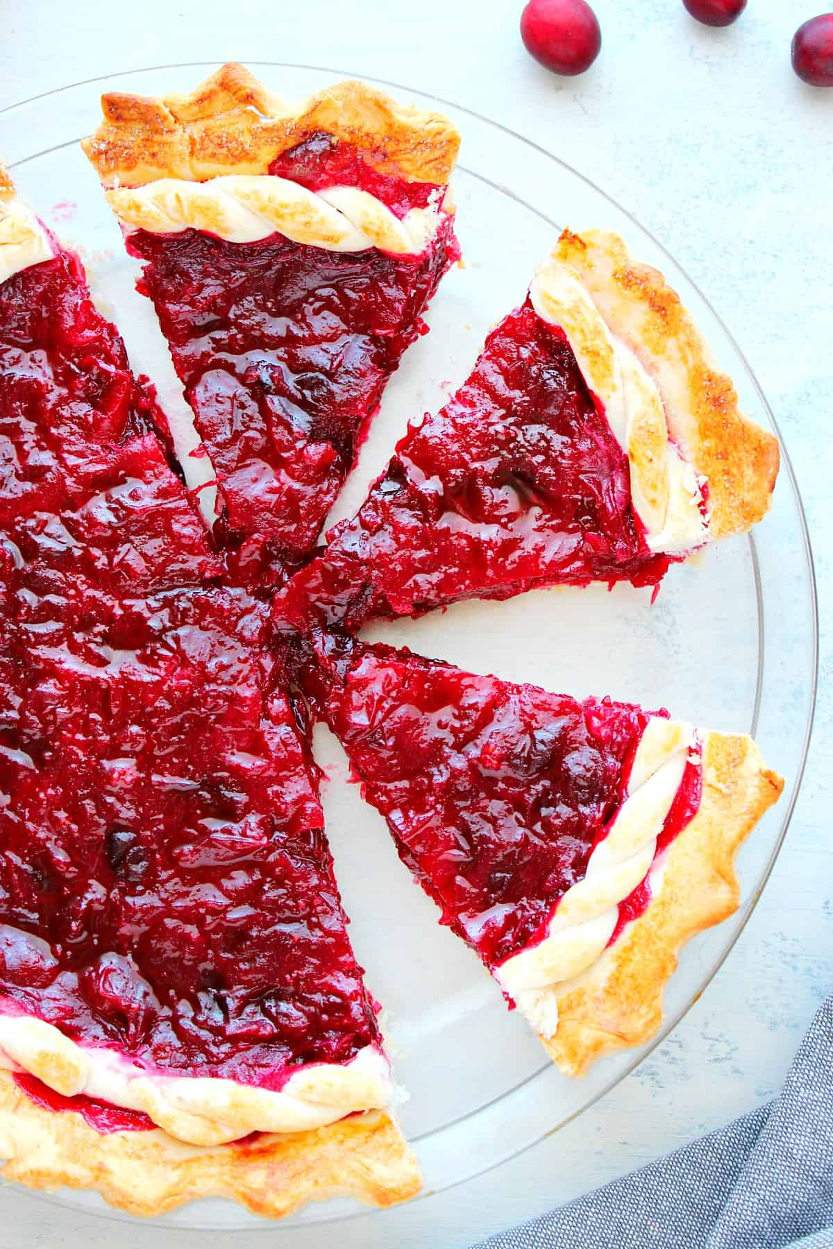 Cranberry pie in a glass pie plate.