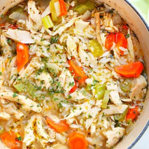 Soup with turkey, vegetables and rice in a pot.