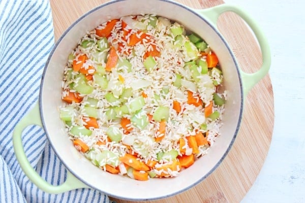 Veggies and rice in a pot.