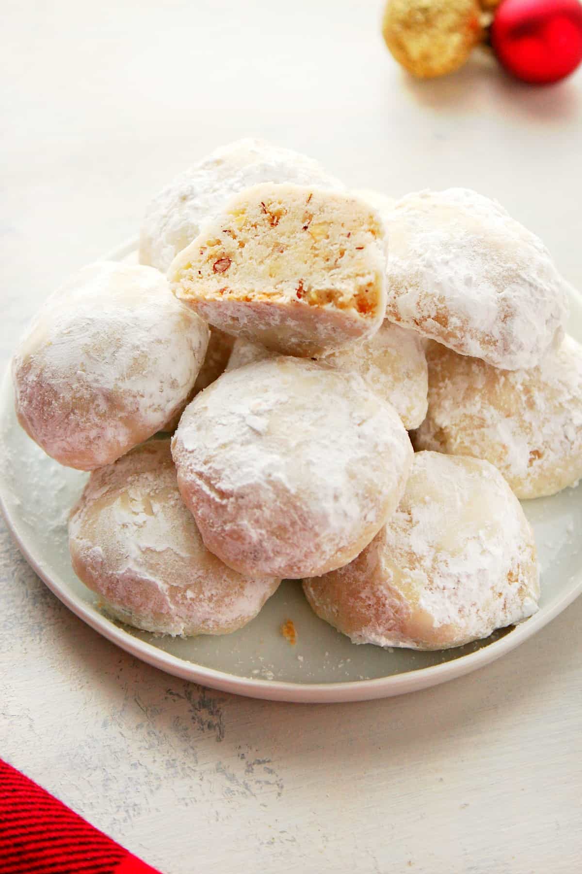 Snowball Cookies recipe Snowball cookies on a small plate.