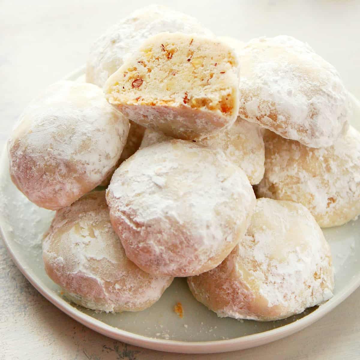 Snowball cookies on a plate.