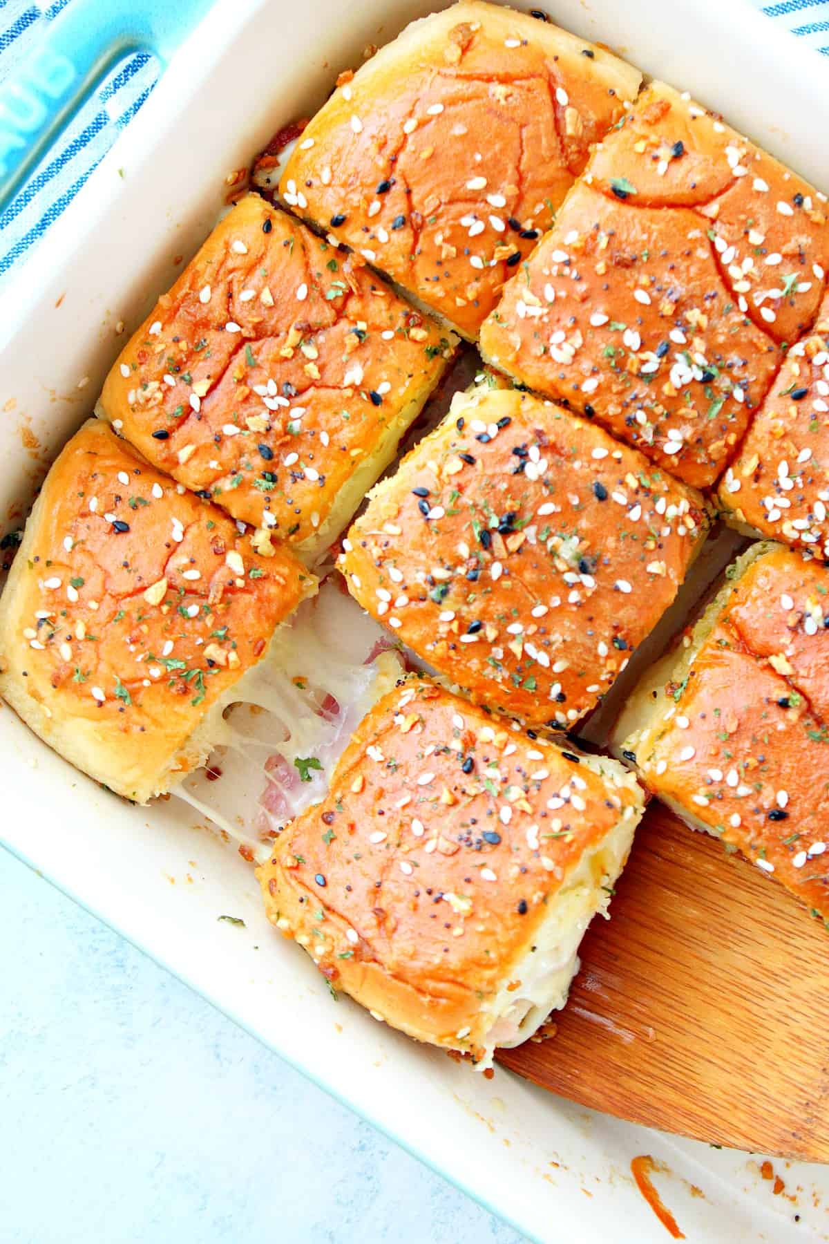 Baked sliders in a casserole dish.