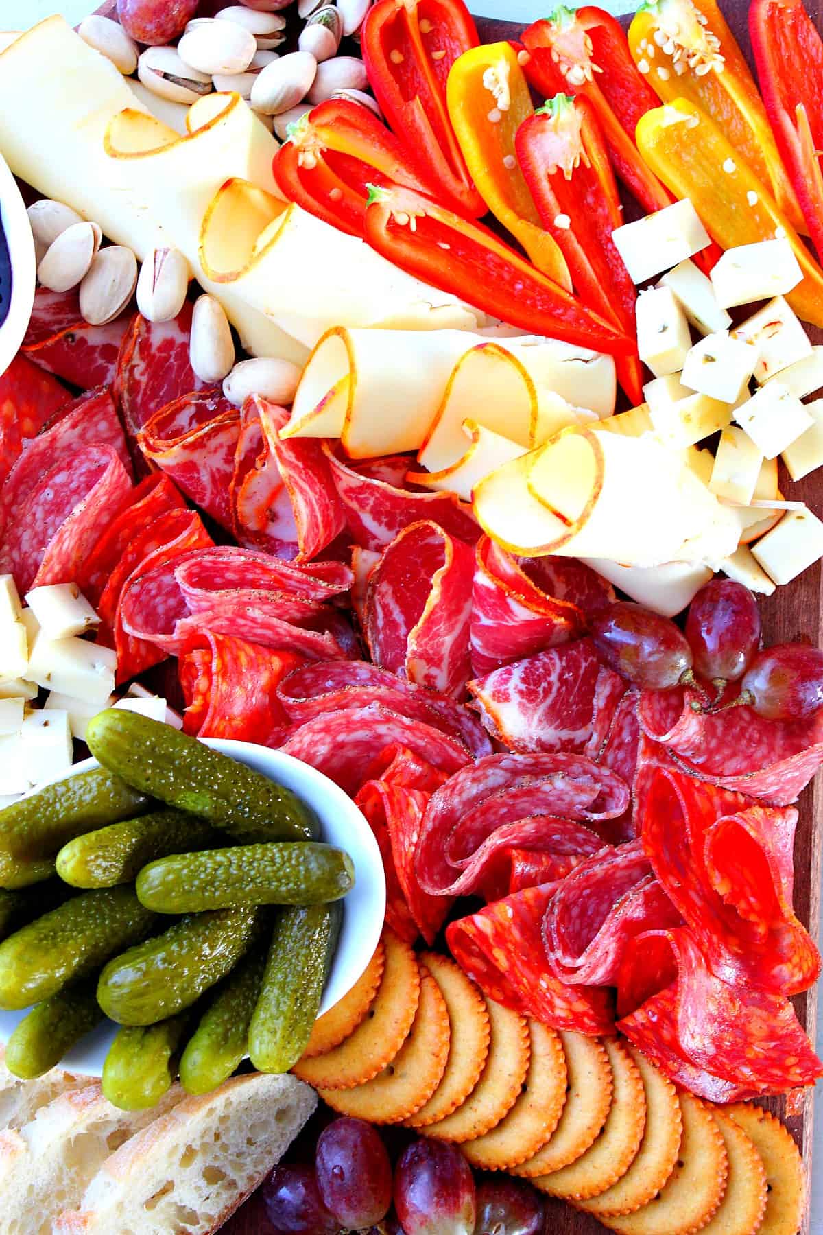 Cheese board with meats and veggies.