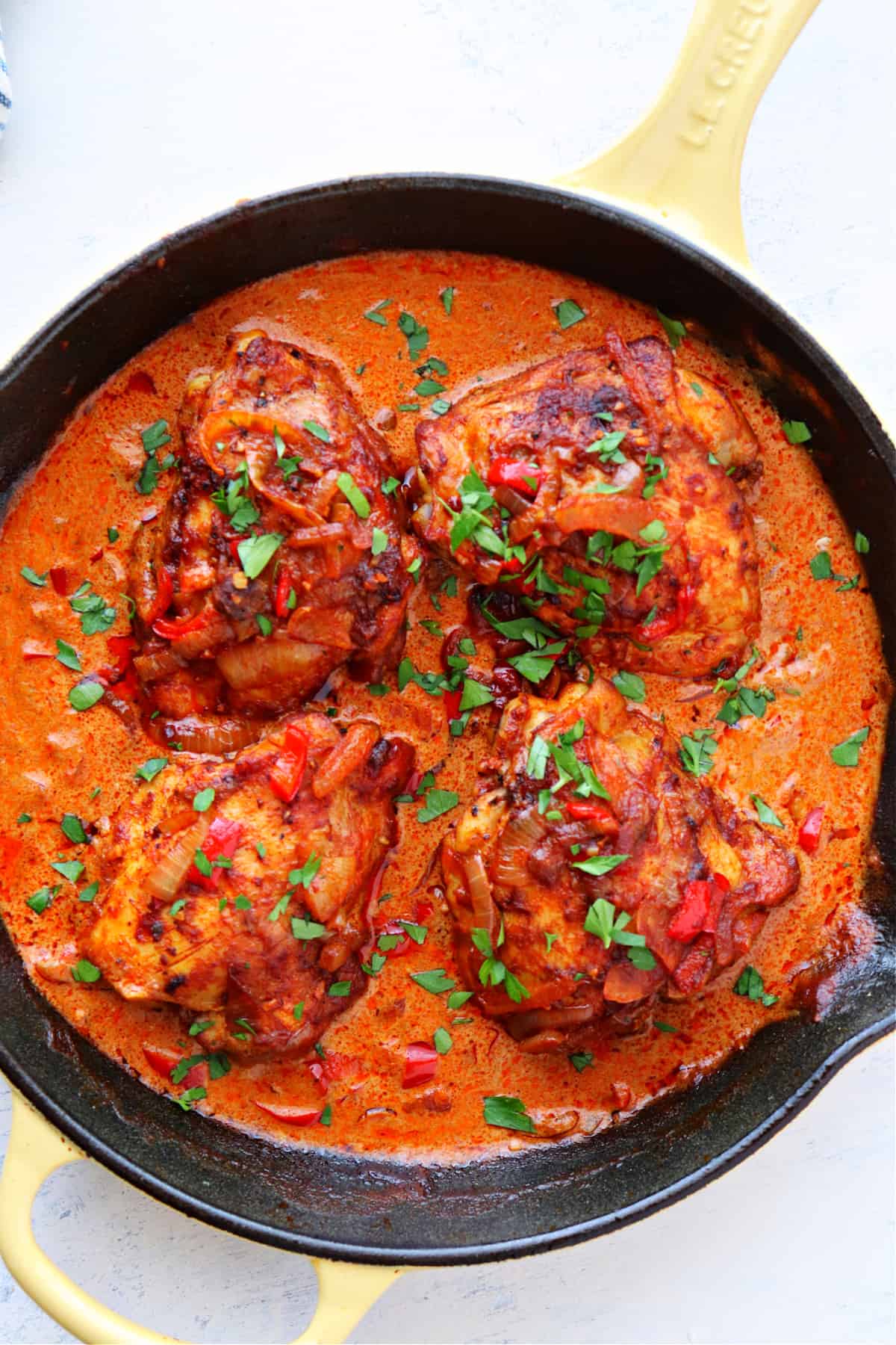 Chicken Paprikash recipe Chicken in paprika sauce in a skillet.
