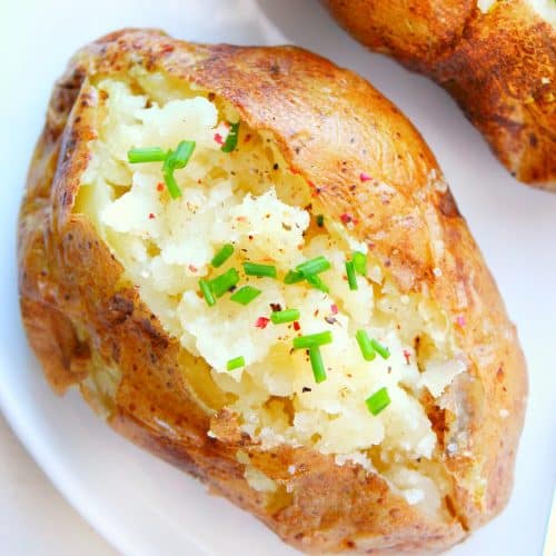 Baked potato on a plate.