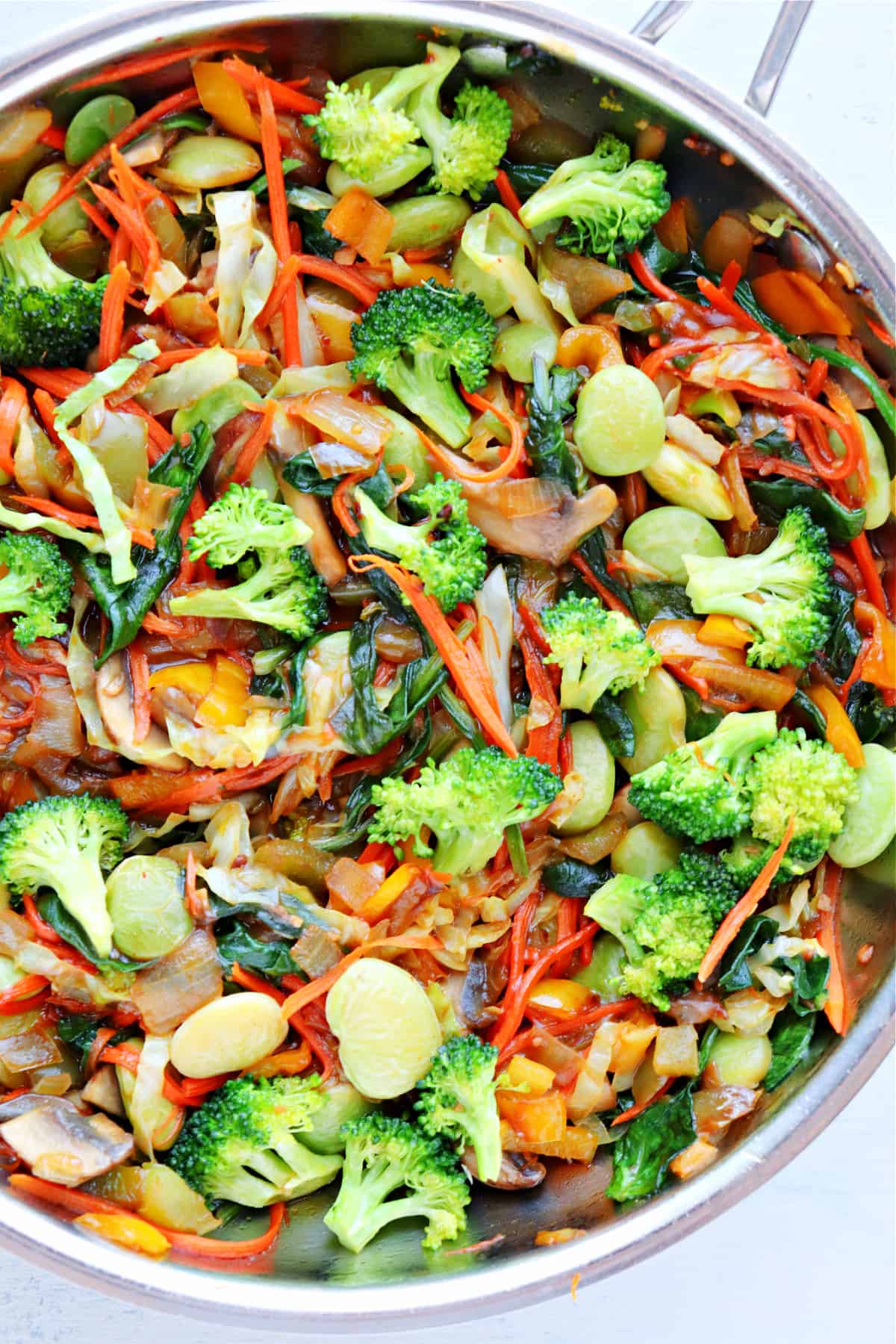 Close up of cooked veggies in pan.