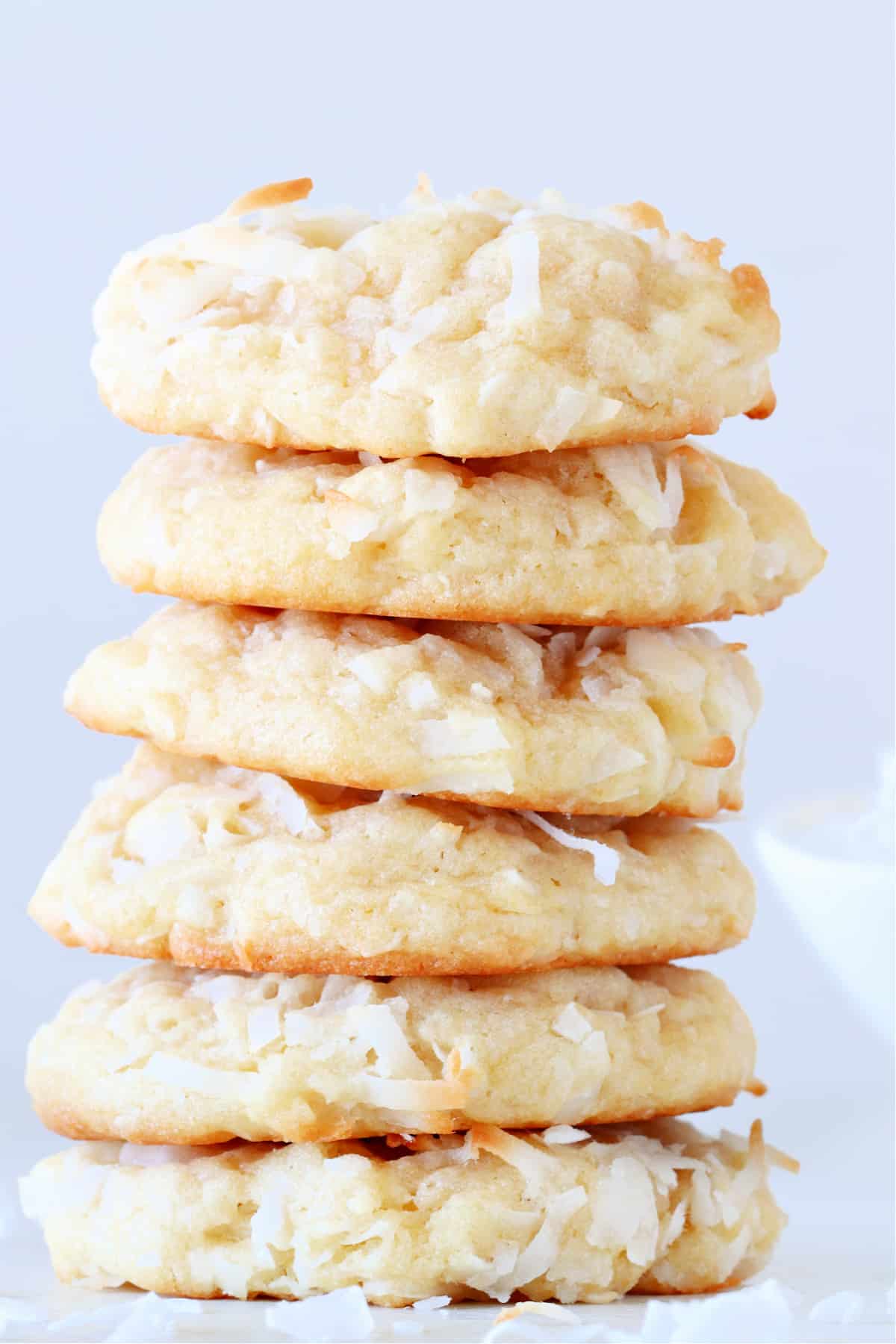 Coconut Cookies recipe Cookies stacked on a plate.