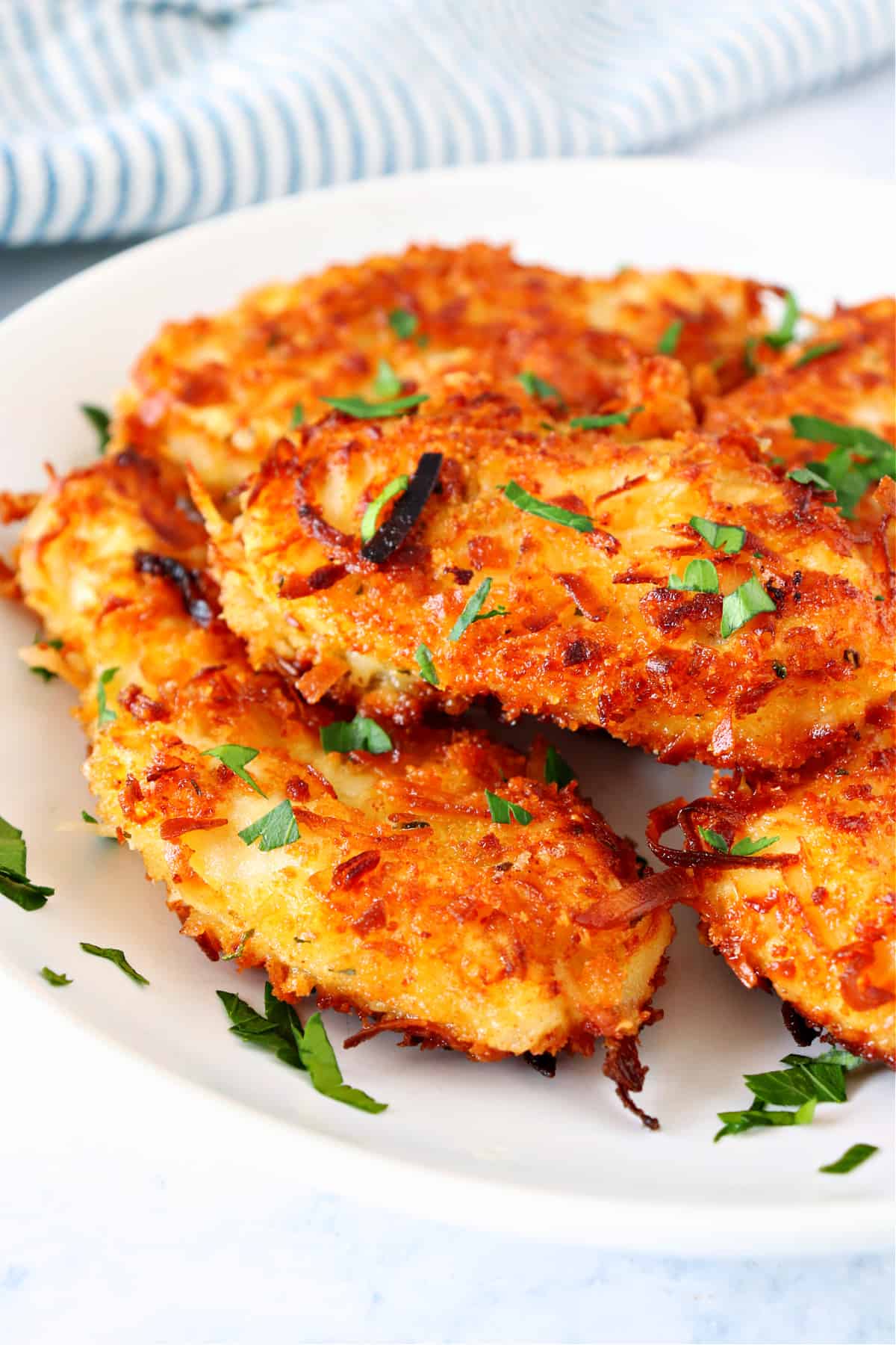 Crispy Coconut Chicken recipe Coconut chicken pieces on a plate.