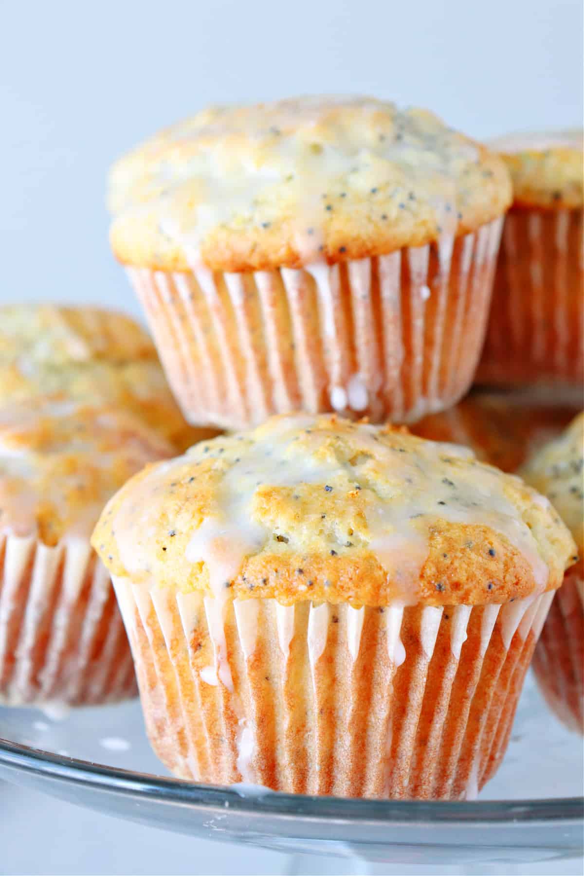 Muffins with glaze on a stand.