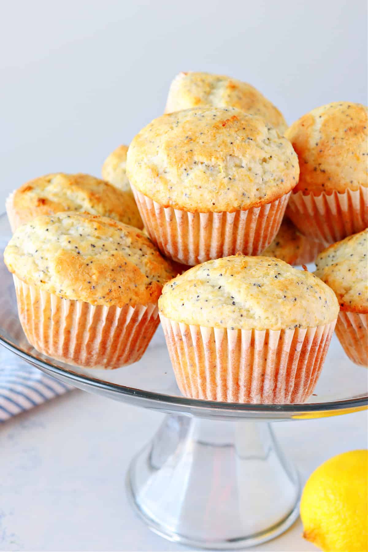 Lemon Poppy Seed Muffins Muffins on a glass stand.