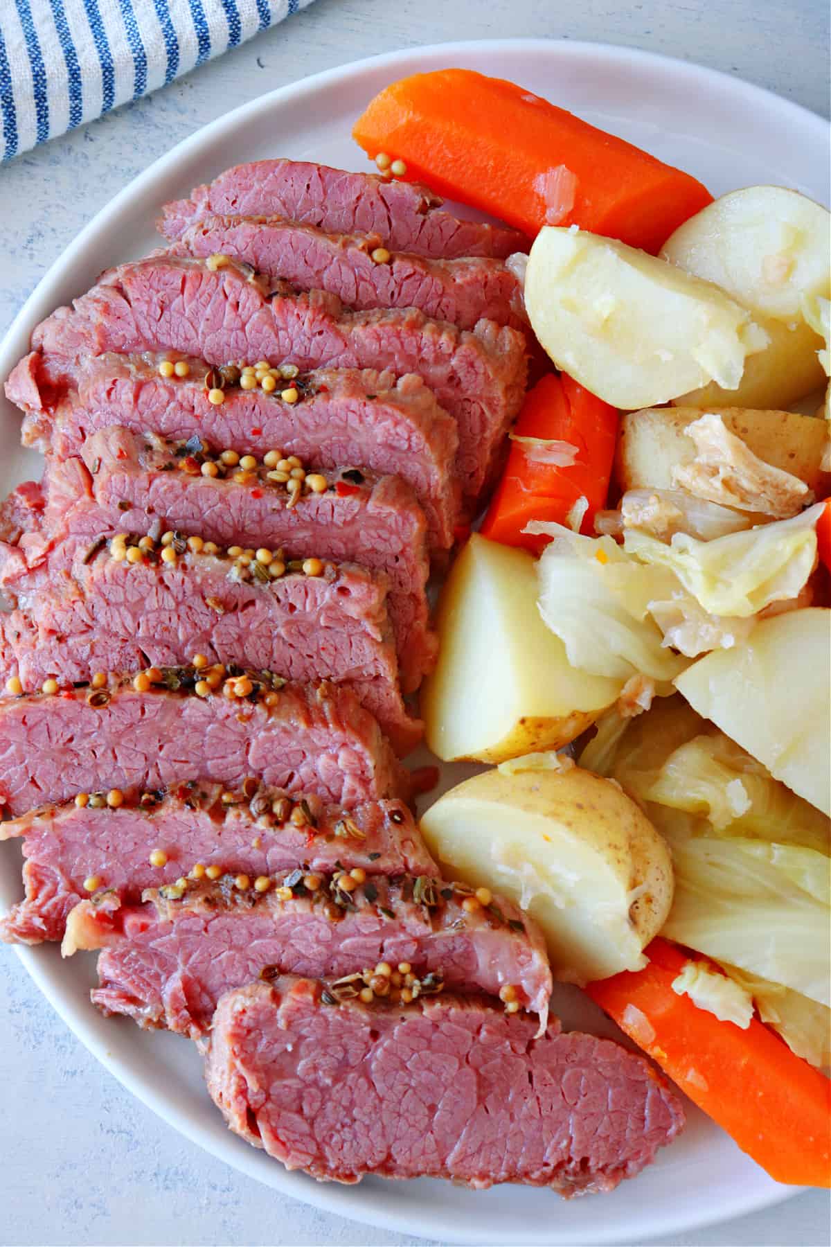 Sliced beef and vegetables on a platter.