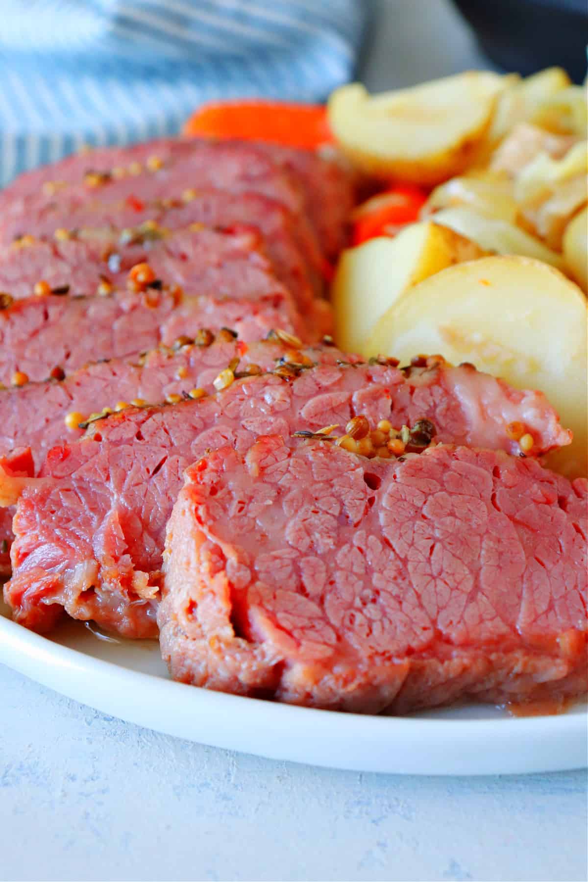 Corned beef with vegetables on a plate.