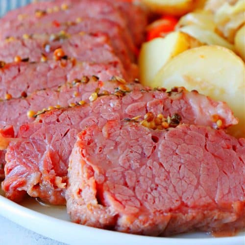 Sliced corned beef on a plate.