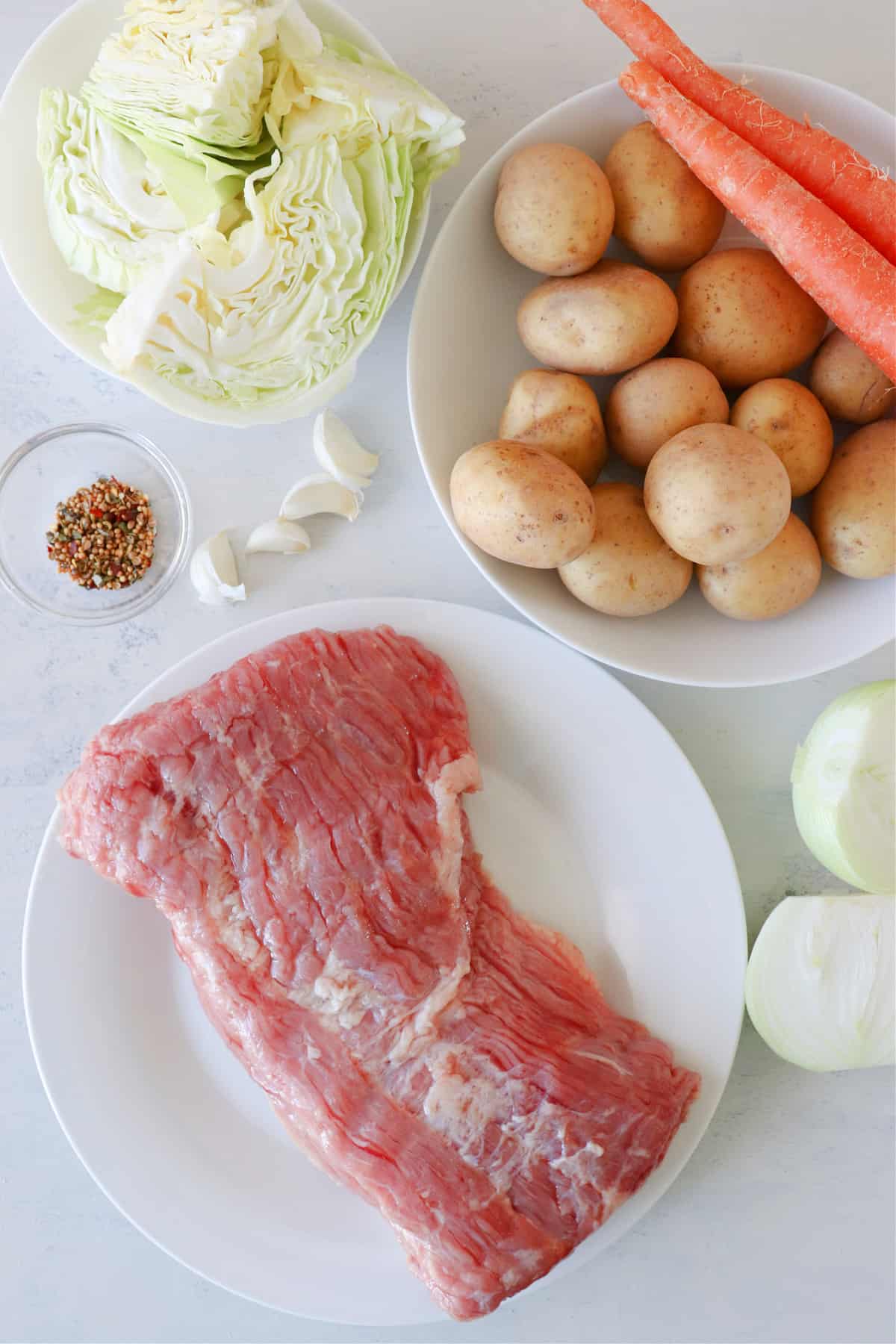 Ingredients for corned beef on a board.