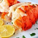 Two lobster tails on a plate.