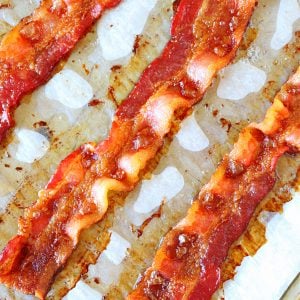 Cooked bacon on parchment.
