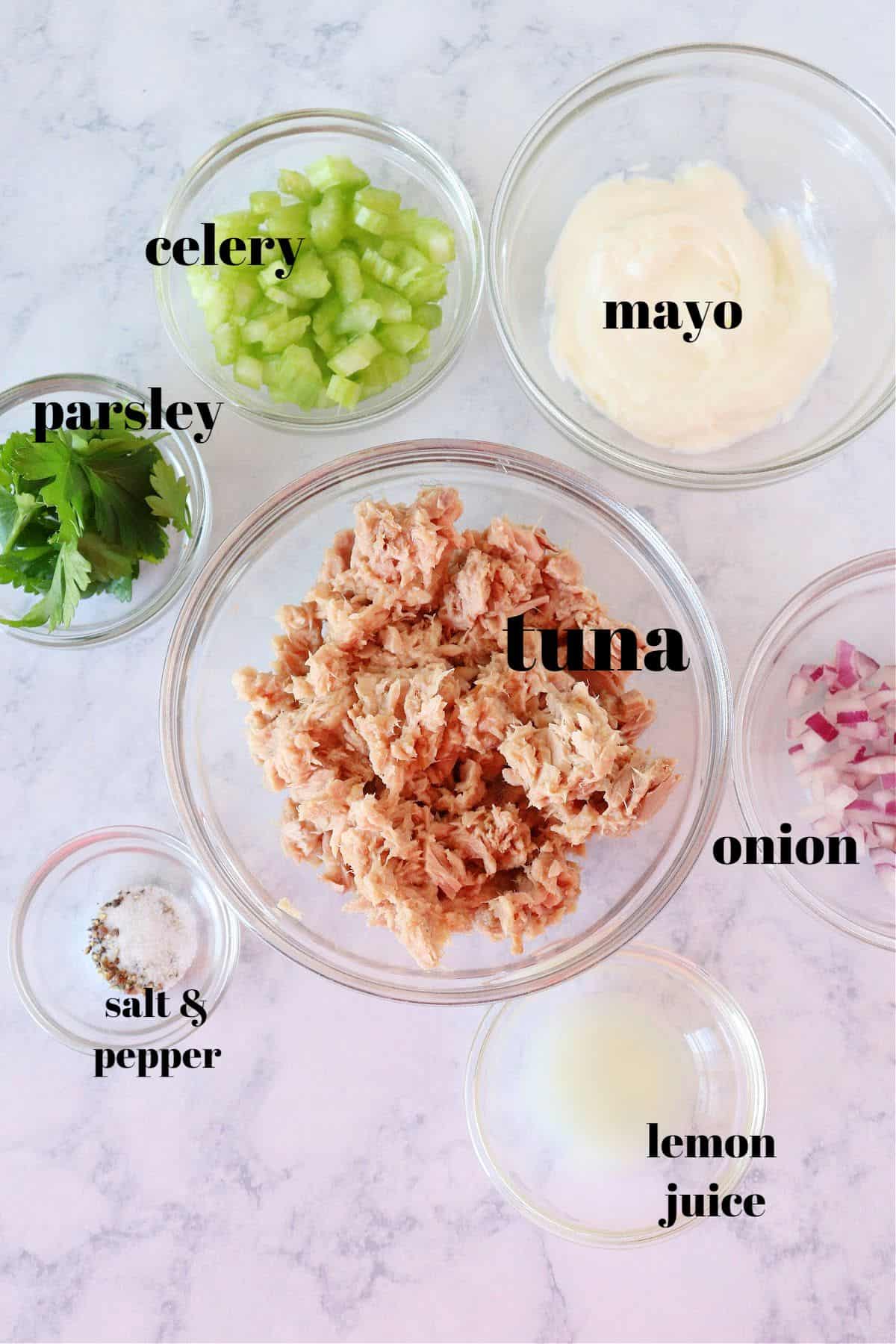 Tuna salad ingredients on a board.