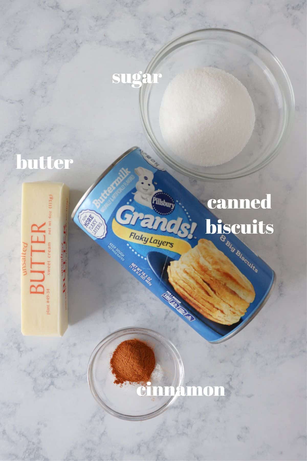 Ingredients for air fryer donuts on a board.