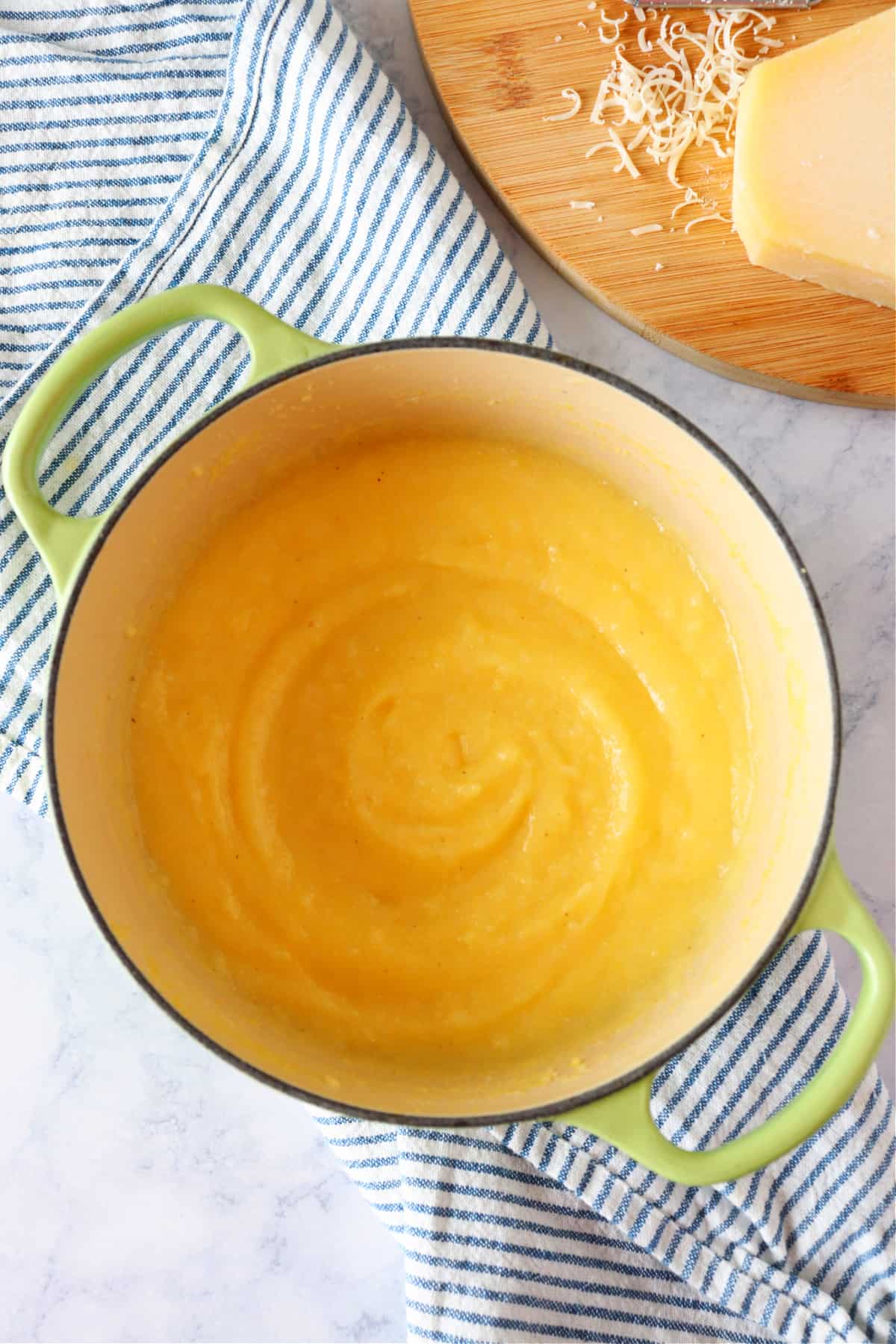 Cooked polenta in a cast iron pot.