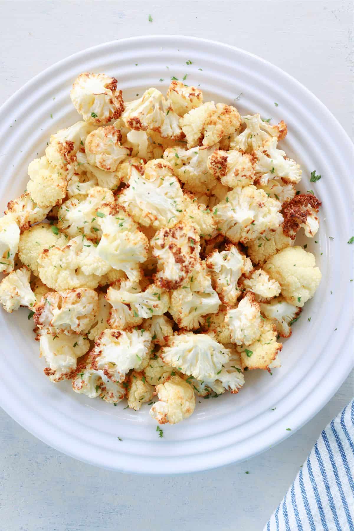 Air fried cauliflower on plate.