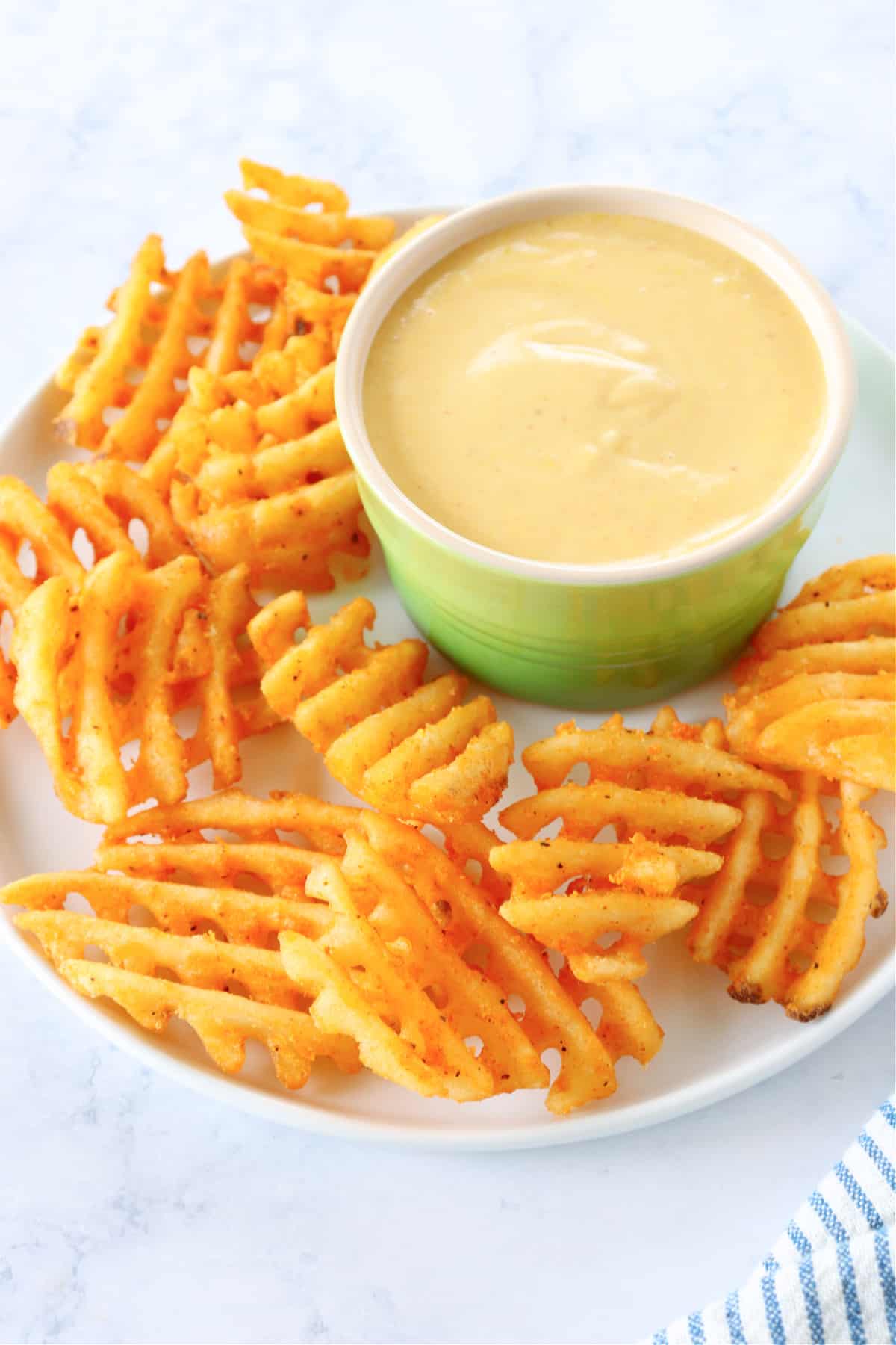 Chick-fil-A sauce copycat recipe Sauce in ramekin with fries on plate.