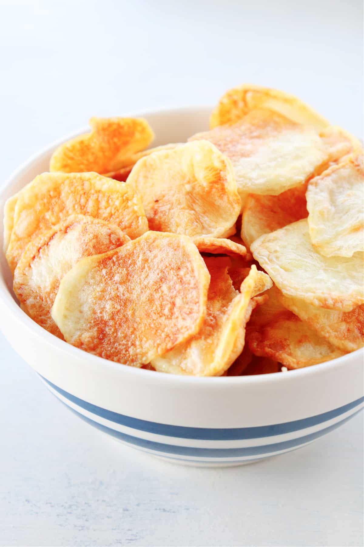 Air Fryer Potato Chips recipe Potato chips in a bowl.