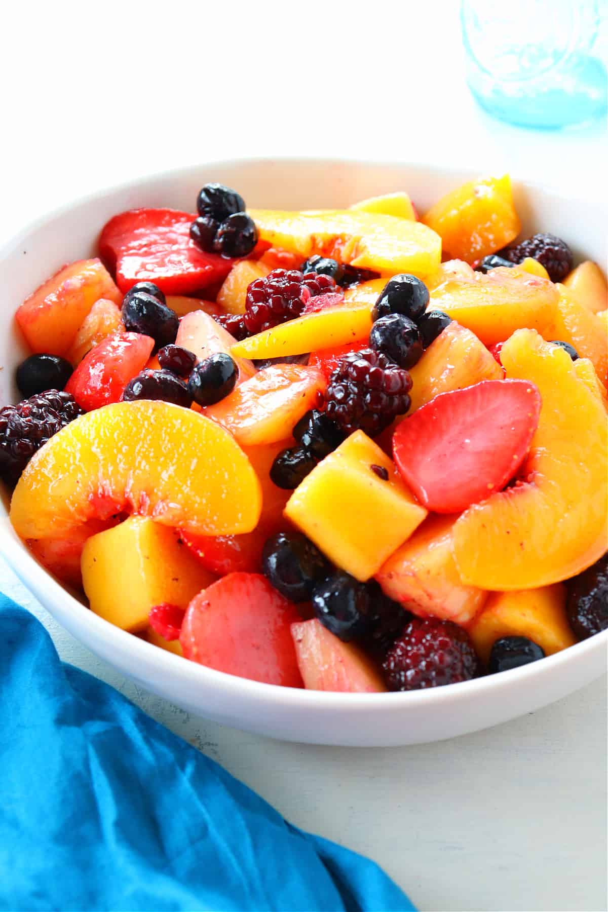 Frozen fruit in a white bowl.