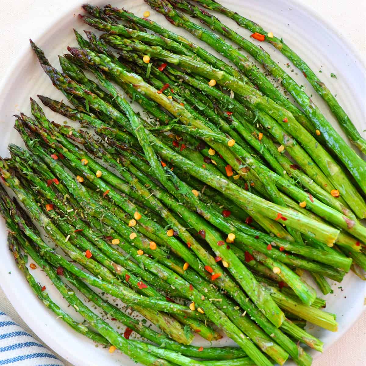 Air fried asparagus on a plate.