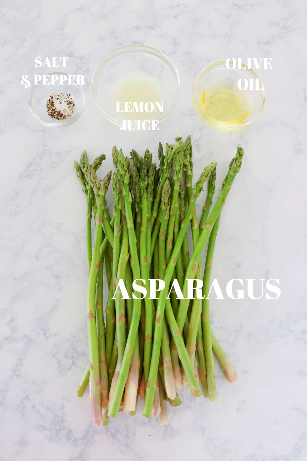 Ingredients for air fryer asparagus on a marble board.