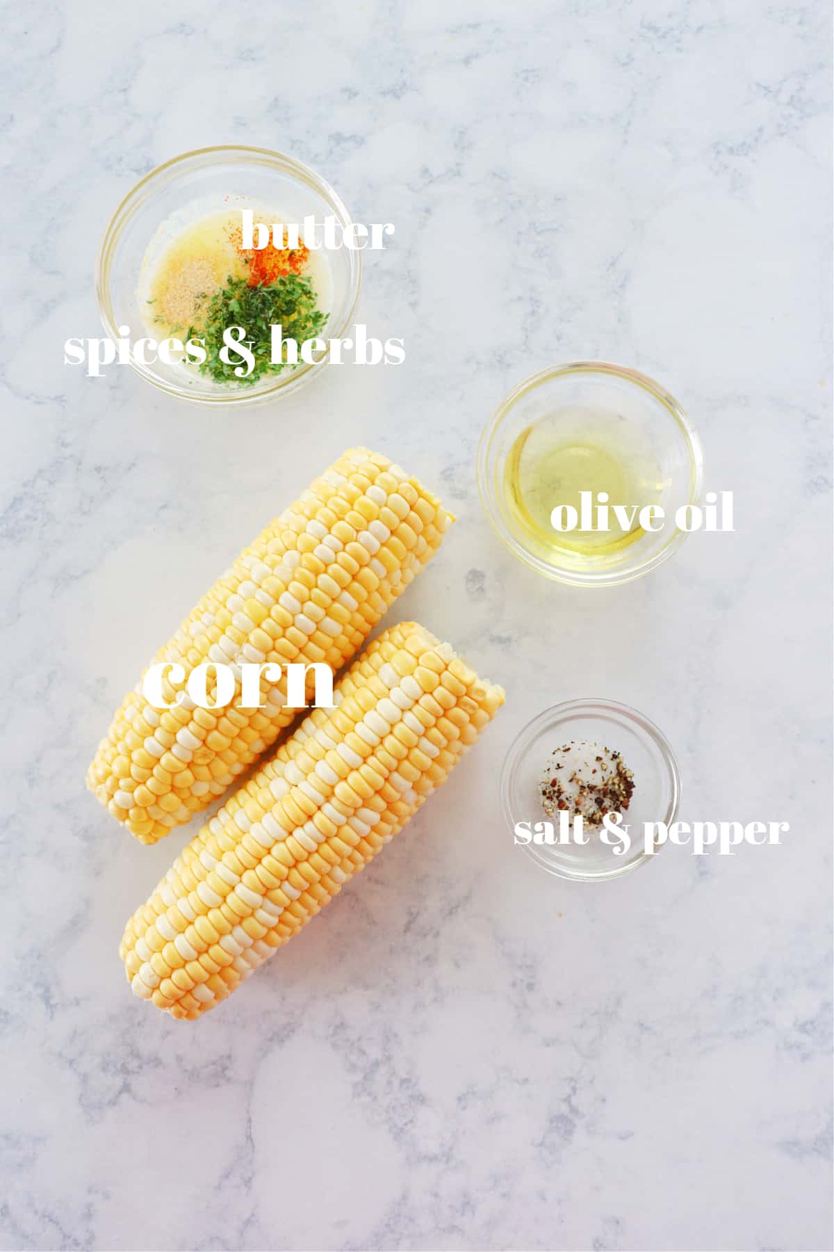 Ingredients for corn on the cob on a marble.