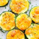 Zucchini with cheese on a plate.