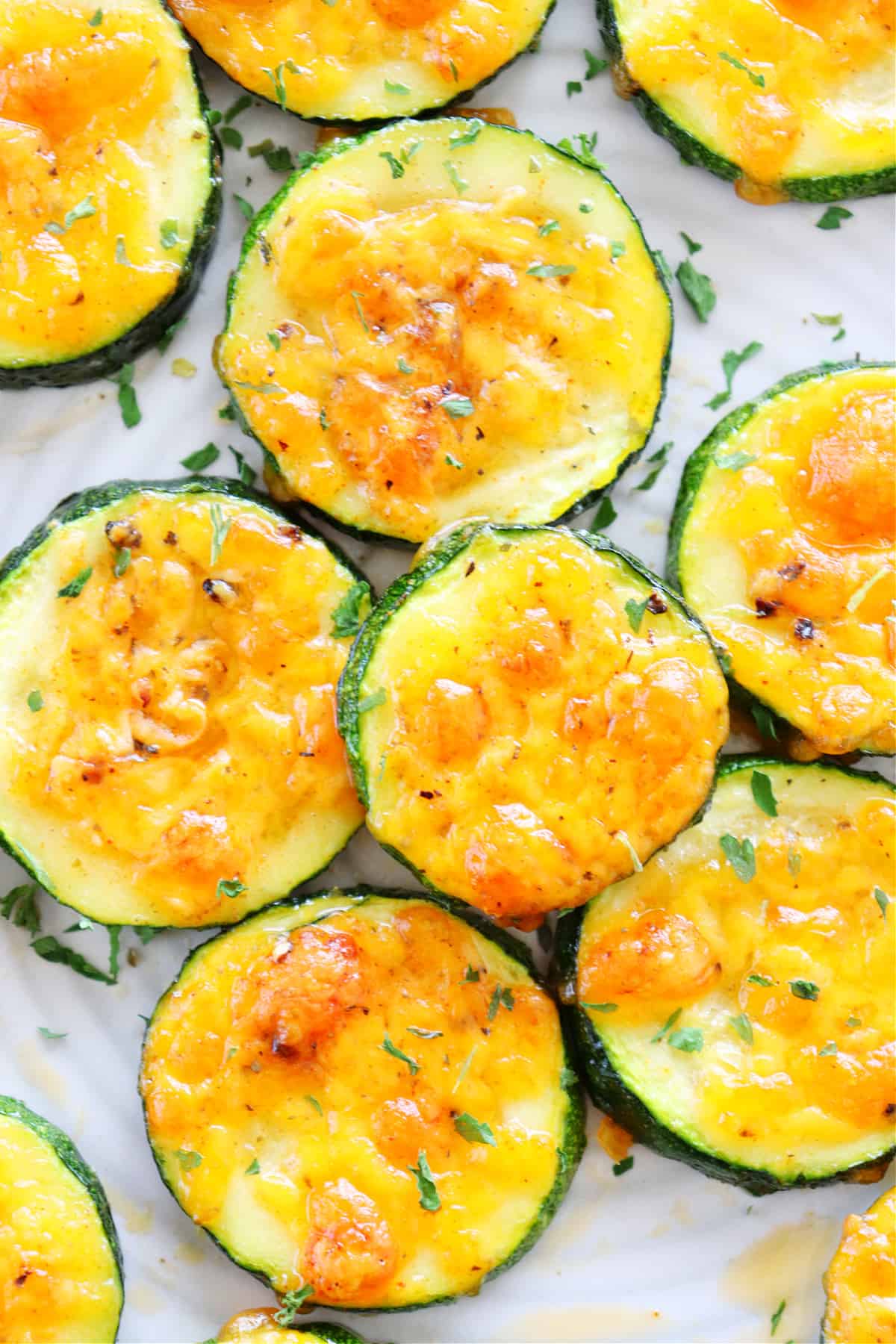 Zucchini with cheese on a plate.