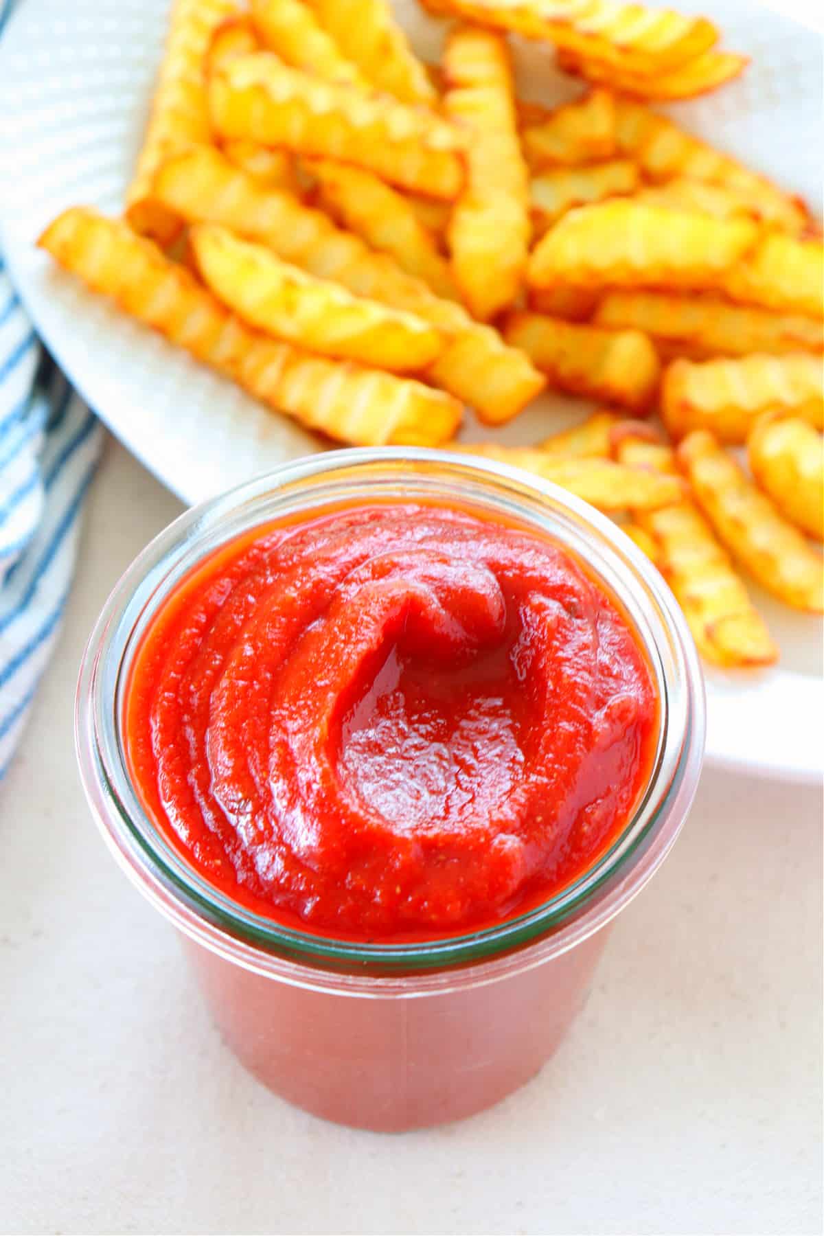 Ketchup in a glass jar.