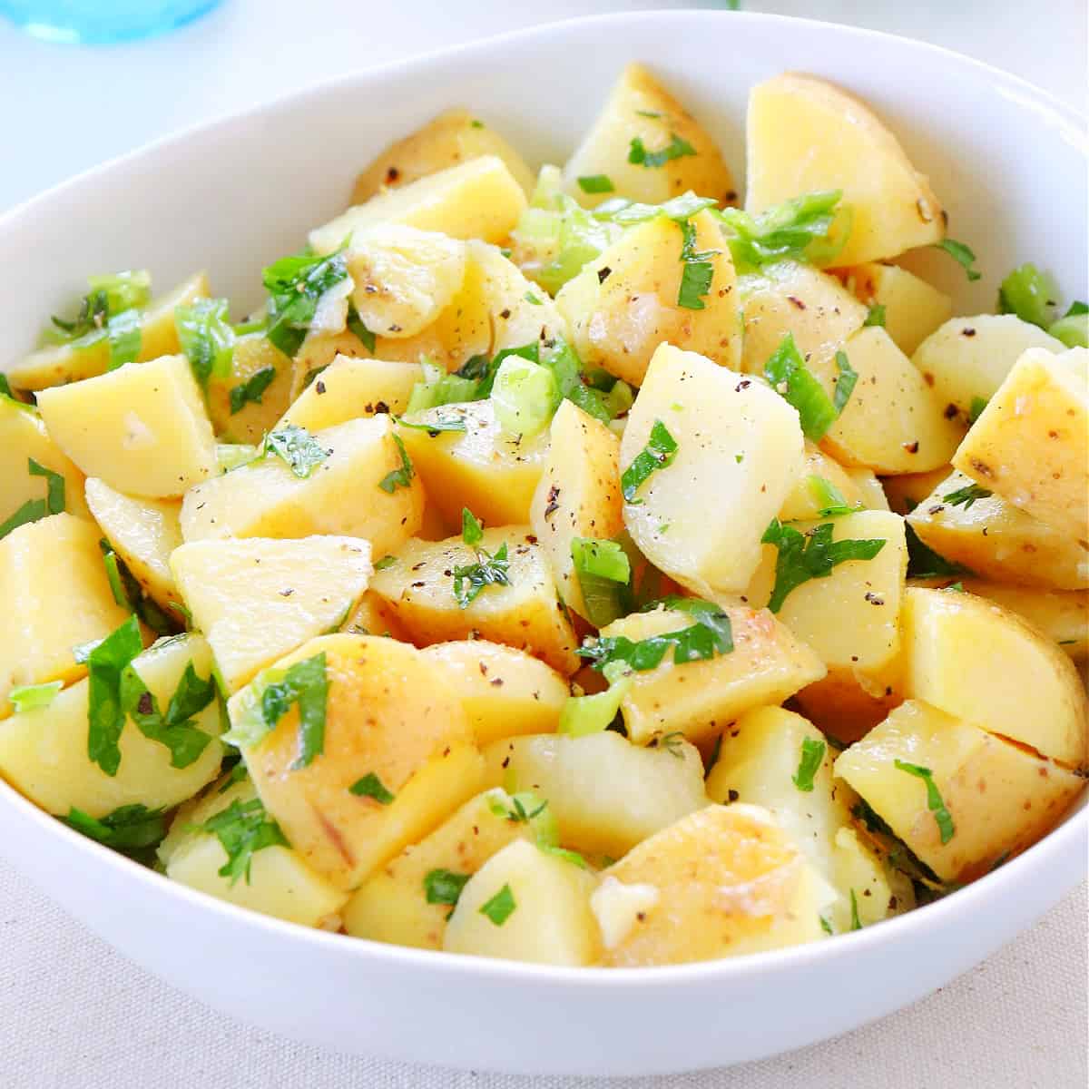 Potato salad without mayo in a serving bowl.