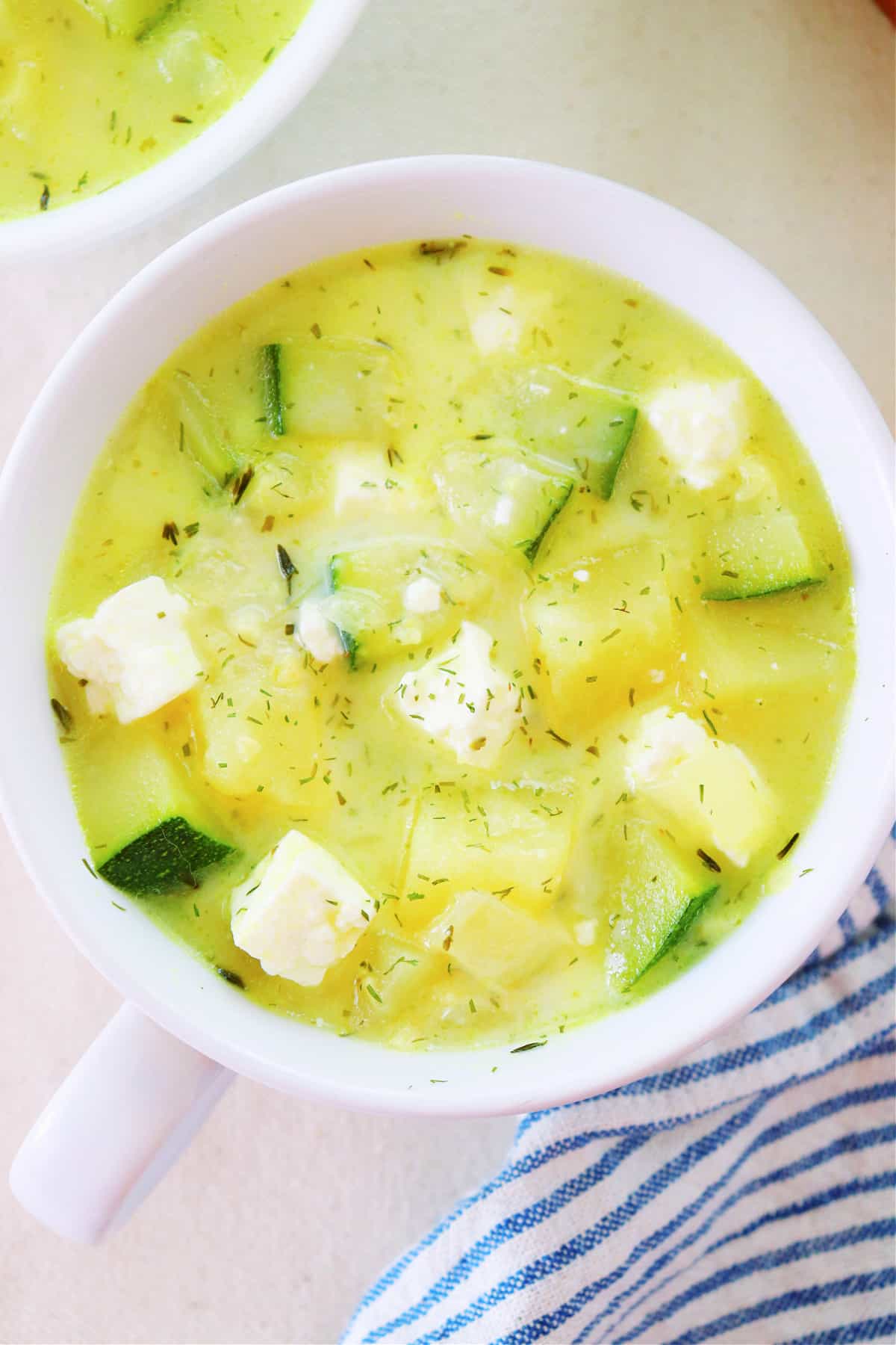 Zucchini soup with feta cheese recipe Zucchini soup in a bowl.