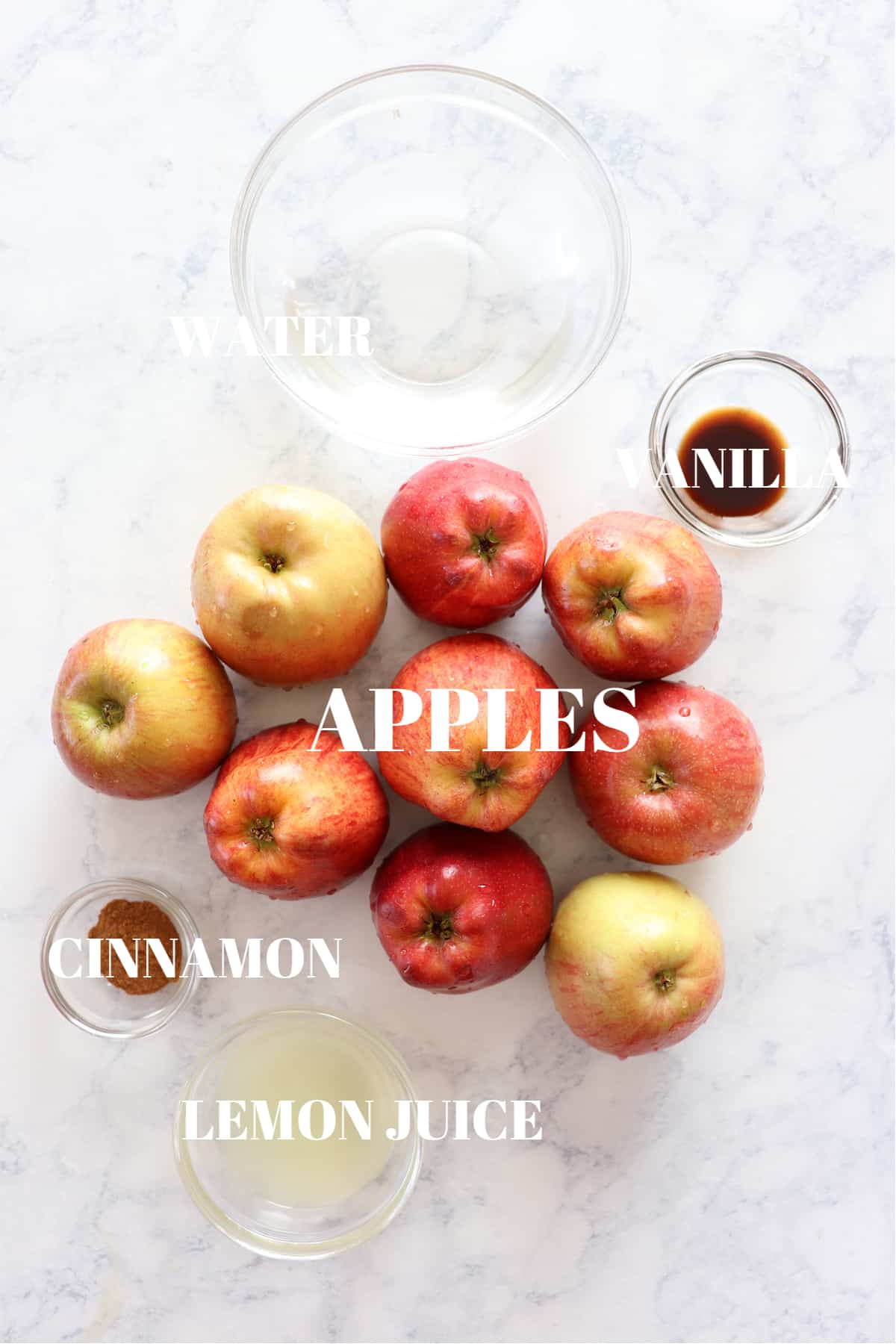 Ingredients for applesauce on a marble board.