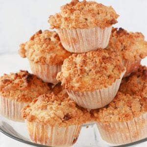 Apple muffins on glass stand.