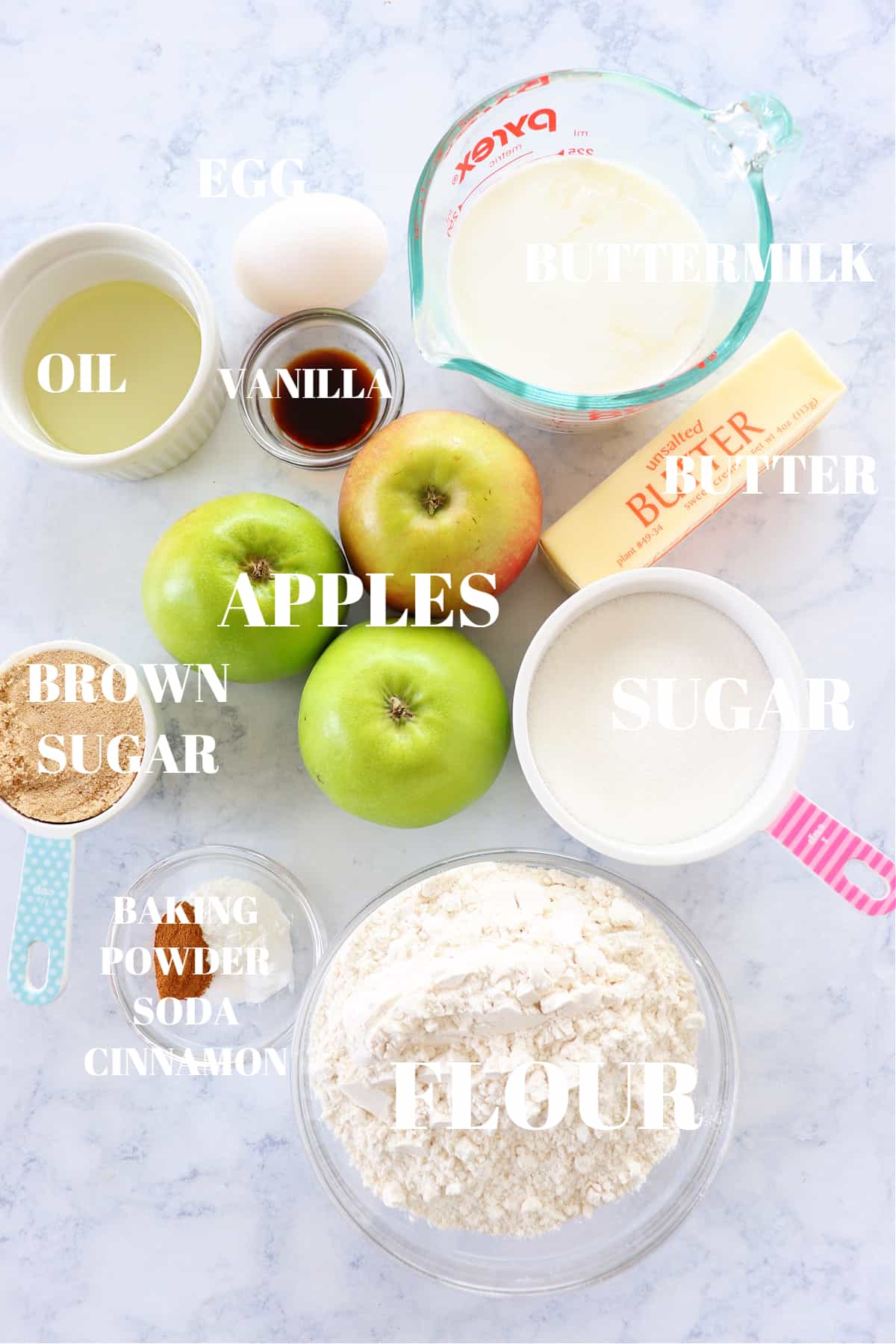 Ingredients for apple muffins on a board.