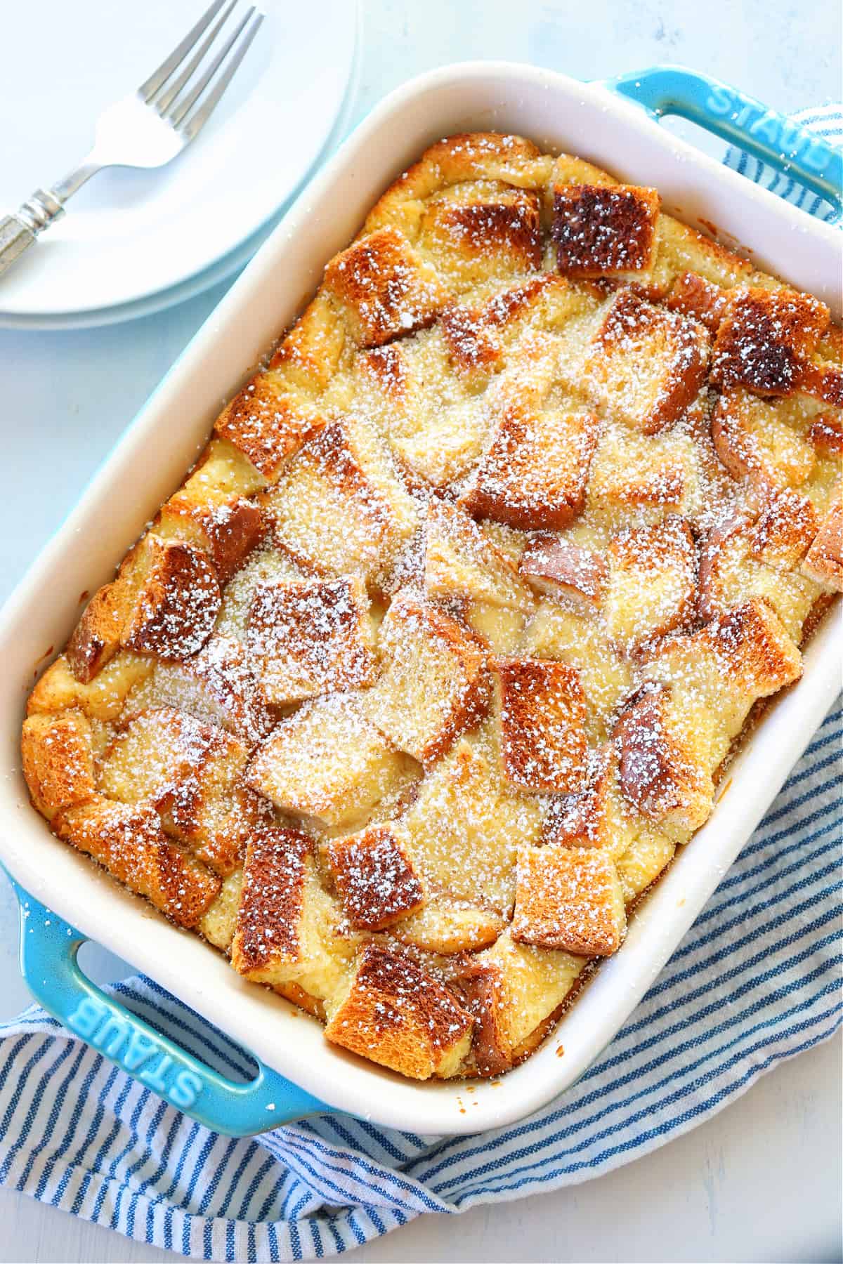 Overhead shot of bread pudding in blue dish.