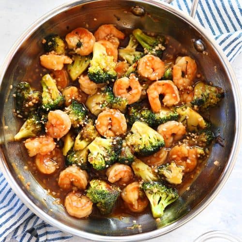 Shrimp with broccoli and sauce in a pan.